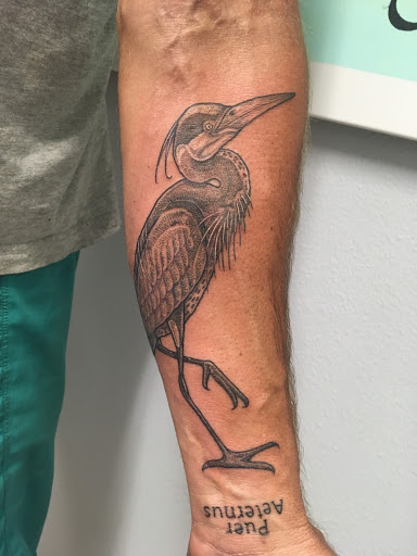 Explore nike tattoo ideas, creative tattoo ideas in Carbondale, available at Bonedale Tattoo