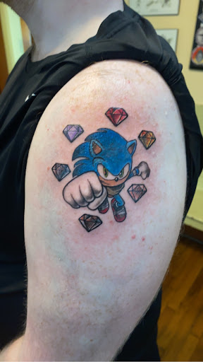 Explore neck tattoo ideas small, creative tattoo ideas in Fort Smith, available at Darklight Tattoo