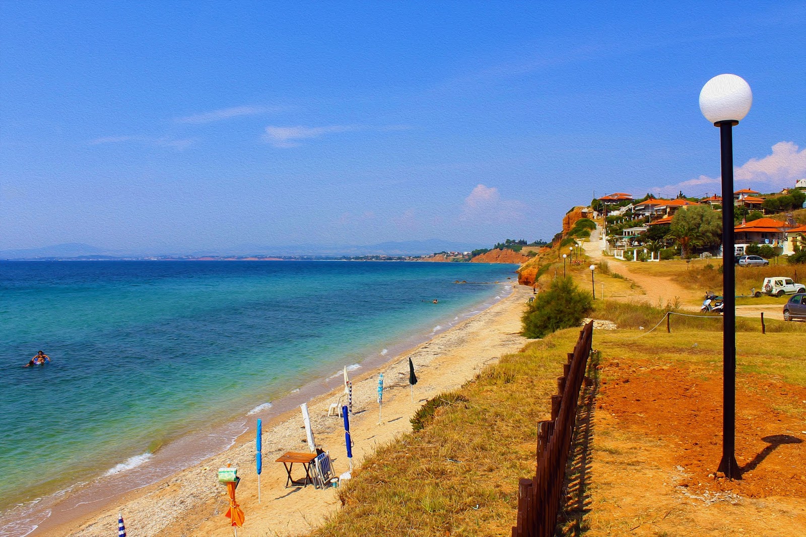 Foto di Schimbalaya beach II con una superficie del sabbia nera e ciottoli