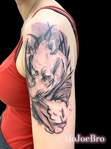 Explore leg tattoo ideas black male, creative tattoo ideas in Crystal City, available at Meraki Tattoo and Piercing