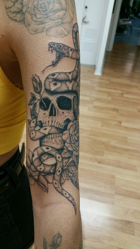 Find boob tattoo ideas for females for your next unique tattoo in Muncie at The Tattoo Studio