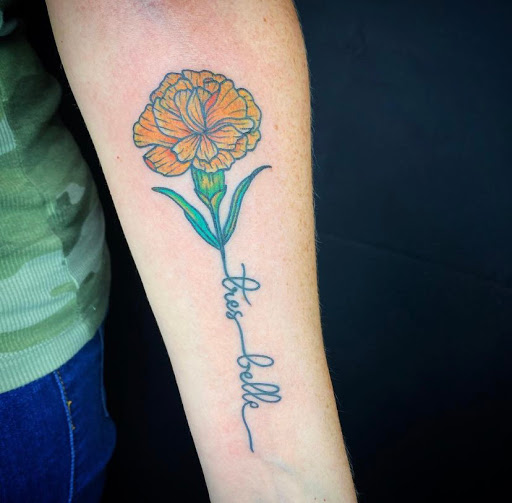 Find in between breast tattoo ideas for your next unique tattoo in Denton at Black Anchor Tattoo