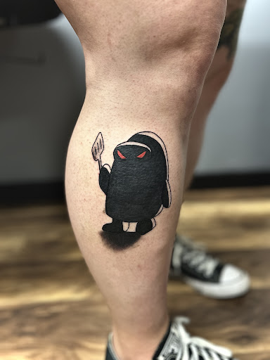 Explore thigh flower tattoo ideas, creative tattoo ideas in New Albany, available at Magnolia Tattoo Company