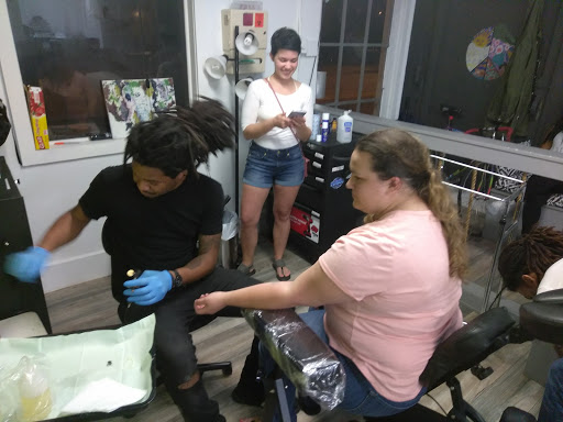 Explore rock n roll tattoo ideas, creative tattoo ideas in Atlanta, available at Iron Palm Tattoos & Body Piercing Atlanta