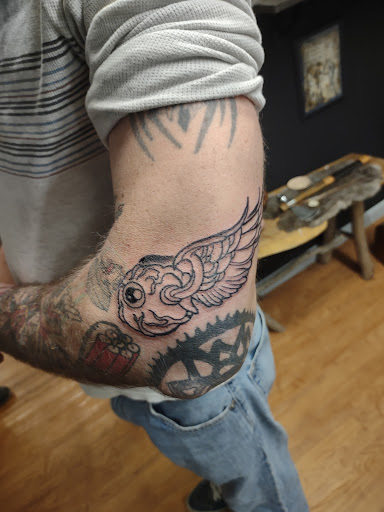 Explore wolf tattoo ideas for guys, creative tattoo ideas in Williamston, available at Inkd Tattoo Parlor