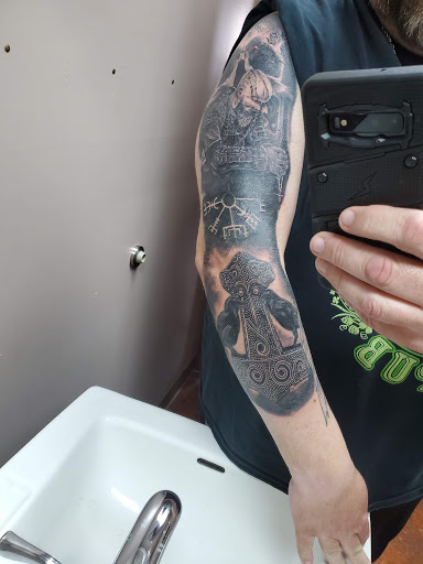 Explore flower back tattoo ideas, creative tattoo ideas in Clawson, available at Eternal Tattoos