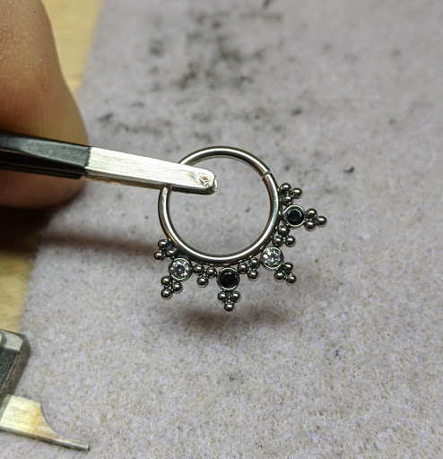 Explore black female tattoos ideas, creative tattoo ideas in Coeur D Alene, available at Relic Moon Fine Jewelry & Body Piercing