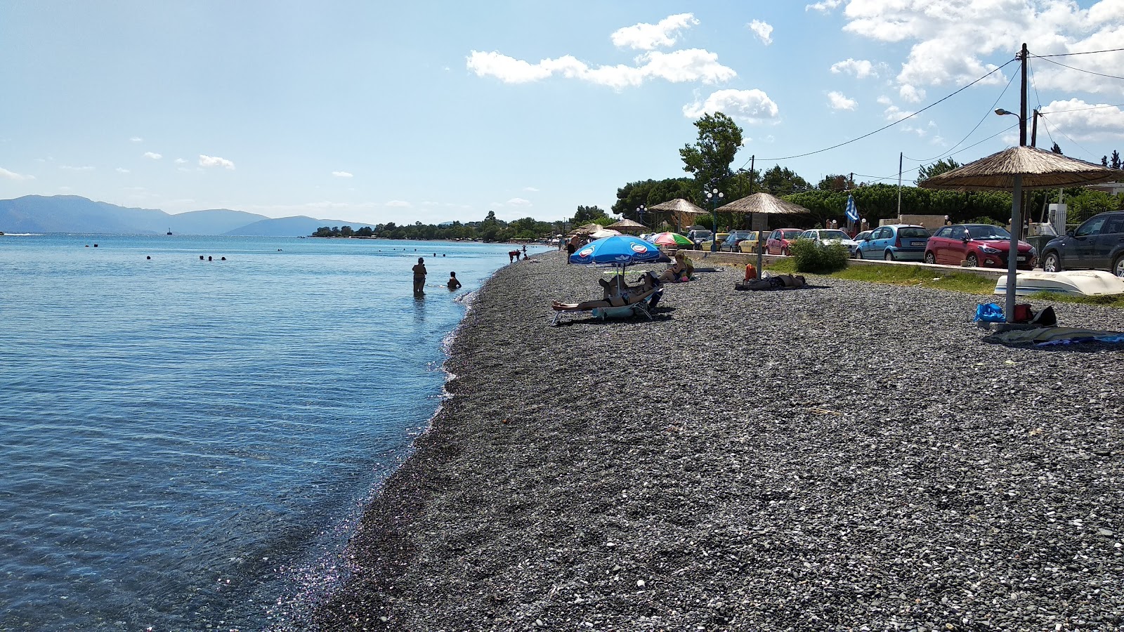 Foto af Politikon beach med blåt vand overflade