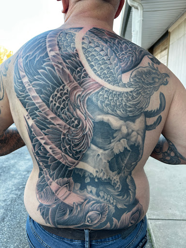 Find arm half sleeve tattoo ideas for your next unique tattoo in Greer at Inkslingers Electric Tattooing