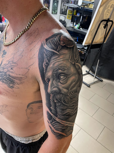 Explore broken chain tattoo ideas, creative tattoo ideas in Sarasota, available at SEVEN SINS Tattoo Studio