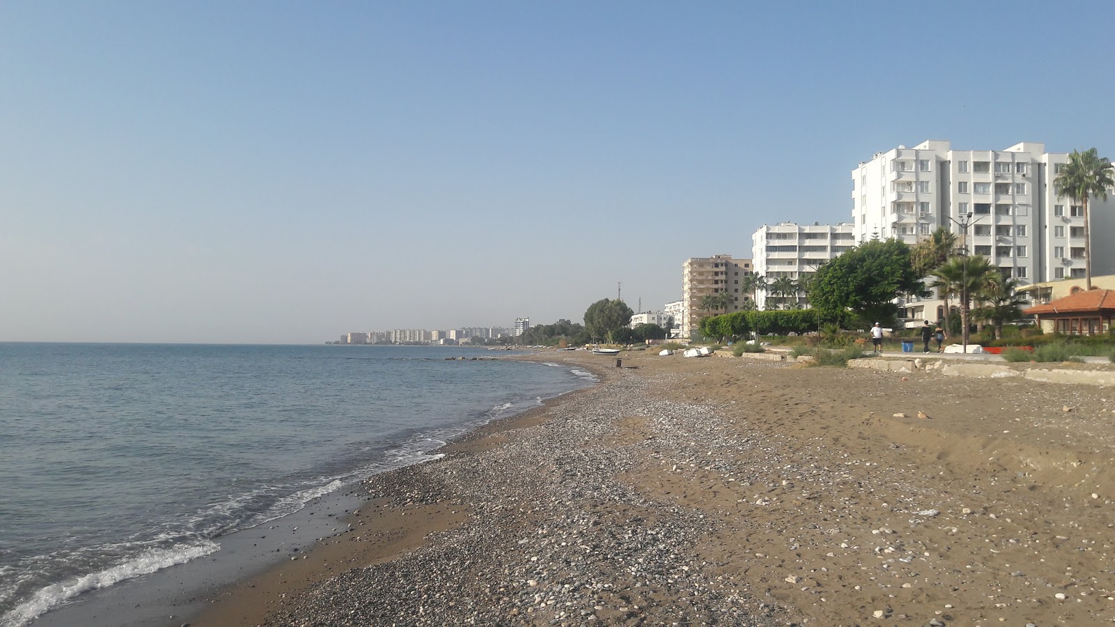 Foto di Tece Sahil beach con una superficie del sabbia beige