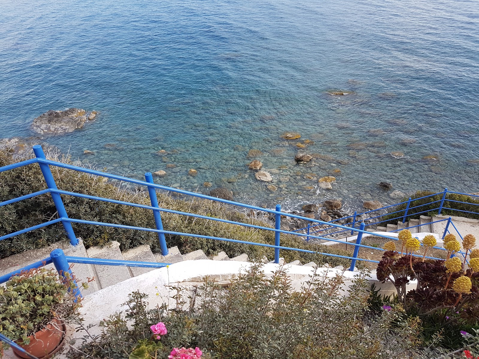 Photo of Lychnistis beach backed by cliffs