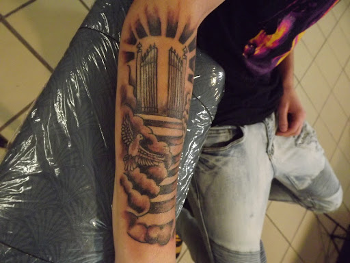 Explore back shoulder tattoo ideas, creative tattoo ideas in Princeton, available at Custom Dreams Tattooing and Body Piercing