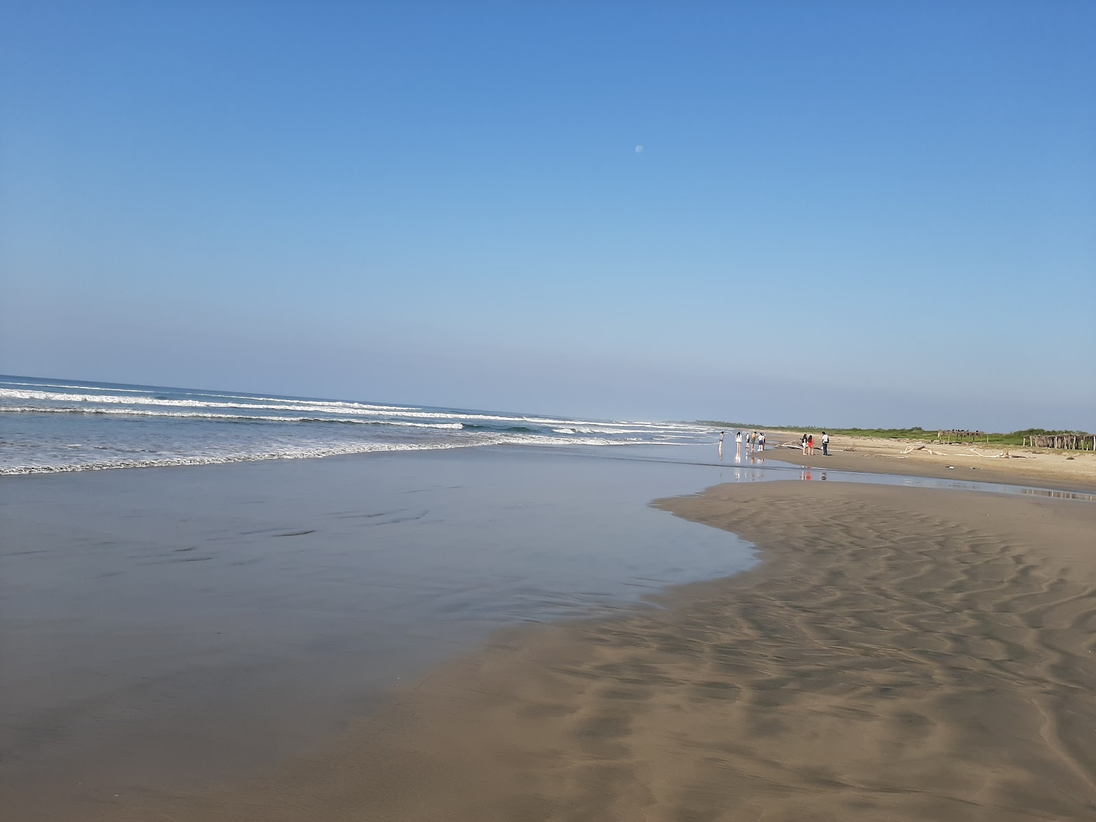 Foto van Playa El Petatillo met fijn bruin zand oppervlakte