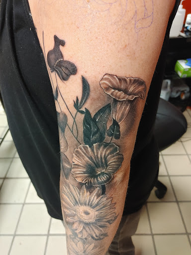 Explore sideburn tattoo ideas, creative tattoo ideas in Hereford, available at Slow Pain Tattoo Body Art Studio