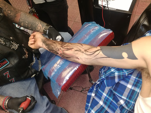 Explore inner bicep tattoo cover up ideas, creative tattoo ideas in Longview, available at Fugis Tattoo Shop