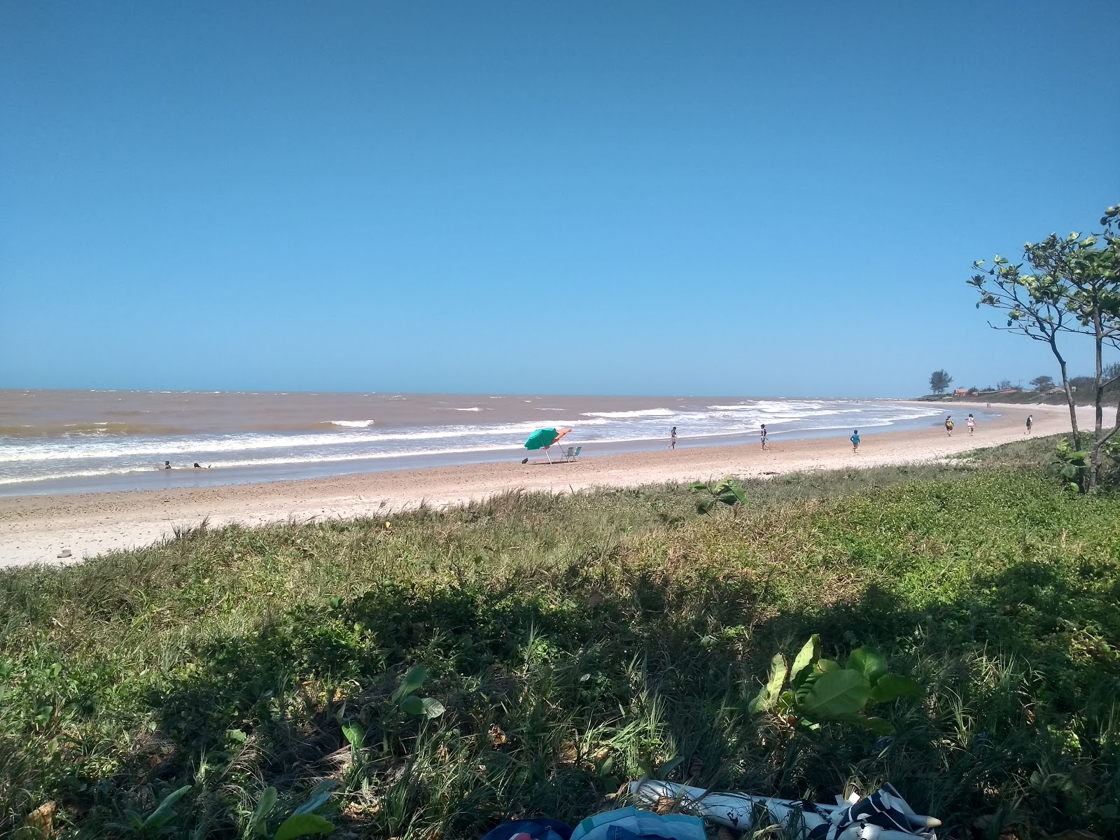 Photo of Guriri Beach with turquoise water surface