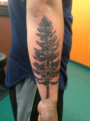 Explore lower back tattoo ideas, creative tattoo ideas in Glenwood Springs, available at Spyder Rose Tattoo