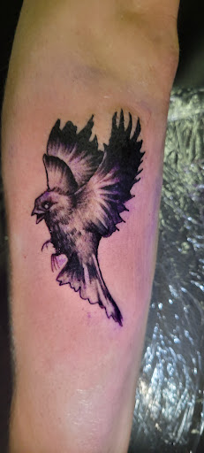 Explore name tattoo placement ideas, creative tattoo ideas in Angola, available at Hoodlum Ink