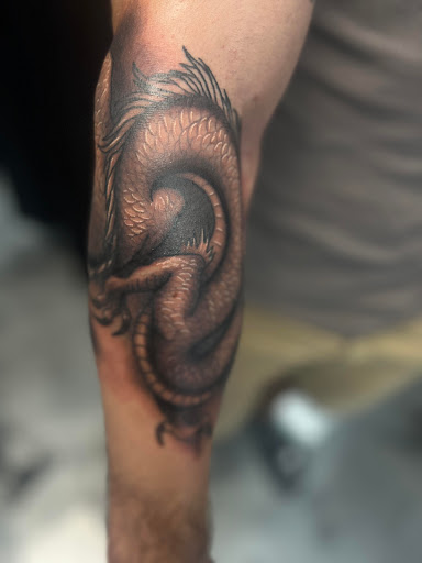 Explore weightlifting tattoo ideas, creative tattoo ideas in Fayetteville, available at American Tattoo Society of Fayetteville