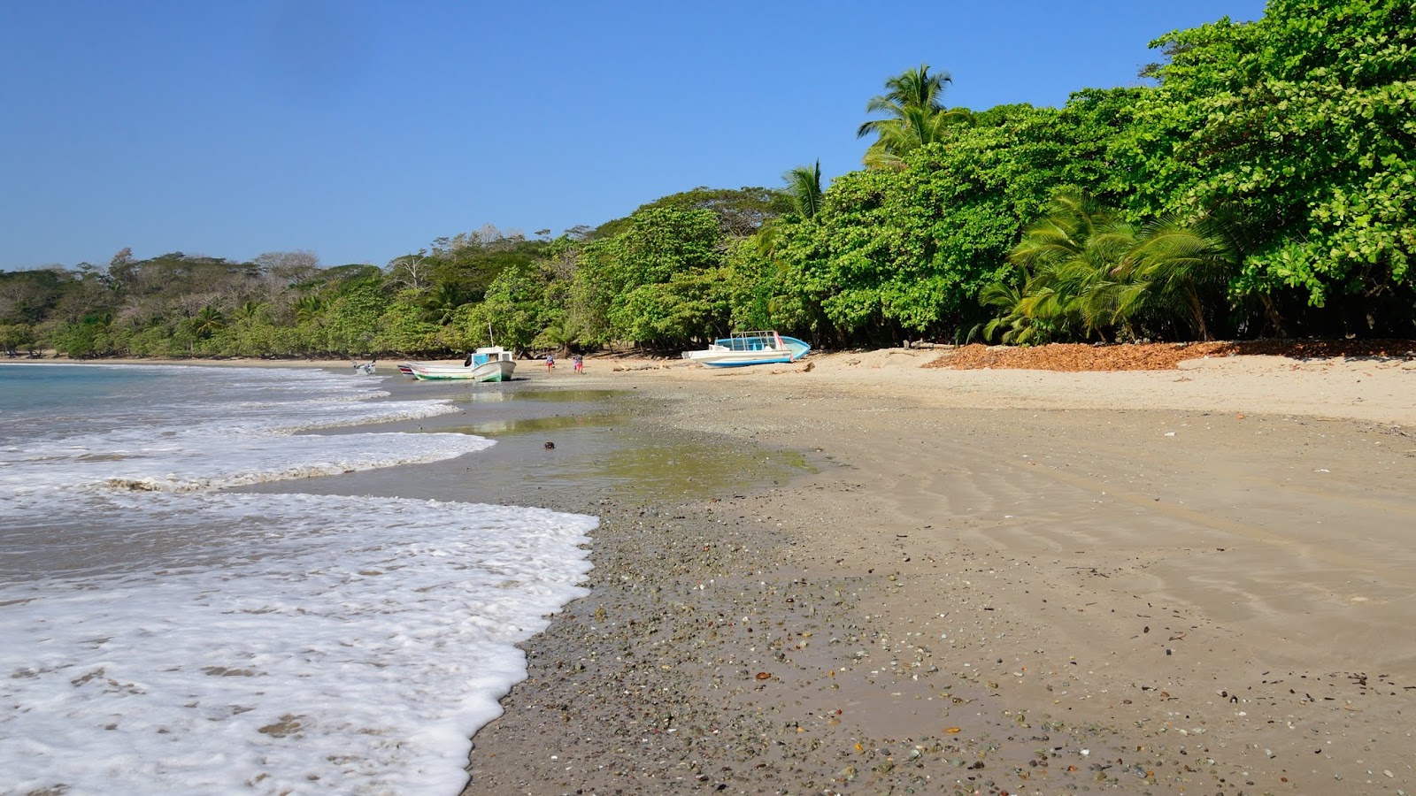 Foto de Manzanillo Beach con arena beige superficie