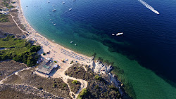 Spiaggia di Porto Pollo'in fotoğrafı geniş bir kıyı şeridi ile birlikte