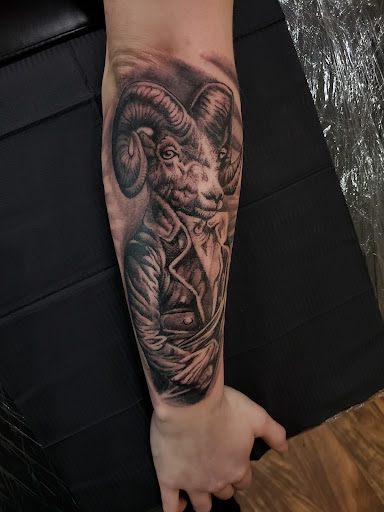 Explore black and grey half sleeve tattoo ideas, creative tattoo ideas in Sheridan, available at BlackbearInk Studio LLC