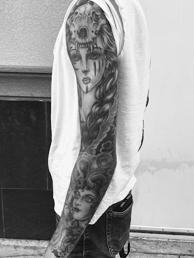 Explore adventurer tattoo ideas, creative tattoo ideas in Georgetown, available at Iron Rite Tattoo South