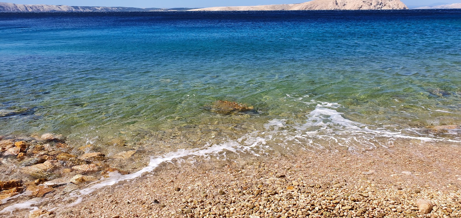 Photo of Plaza Mocunig with turquoise pure water surface