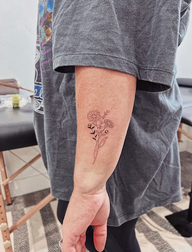 Explore upper back tattoo ideas for men, creative tattoo ideas in Burley, available at Fine Line Ink