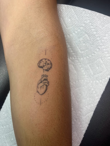 Explore mufc tattoo ideas, creative tattoo ideas in Foley, available at Symbolic Ink Tattoo Studio