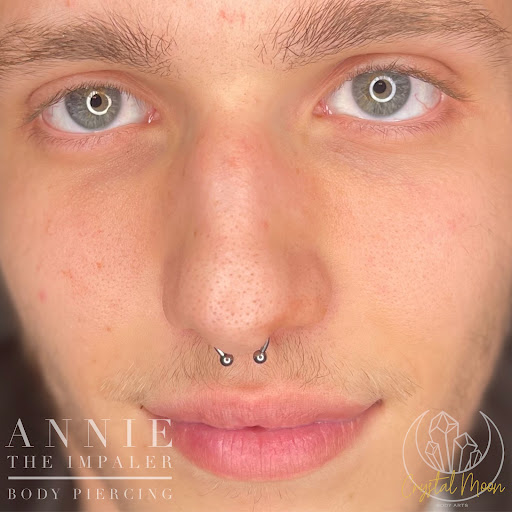 Find tattoo ideas for under the breast for your next unique tattoo in Bloomington at Crystal Moon Body Arts