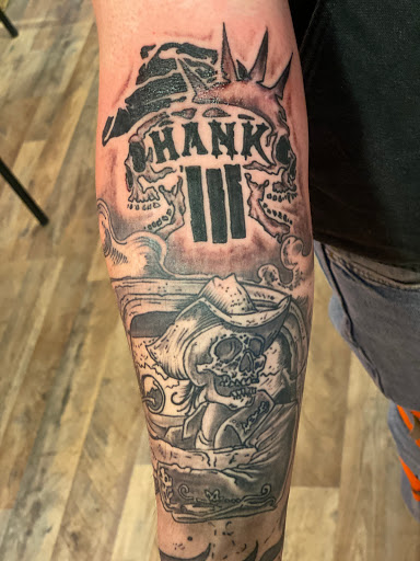 Explore small cross tattoo ideas, creative tattoo ideas in Pikeville, available at The Carbon Canary Tattoo Studio