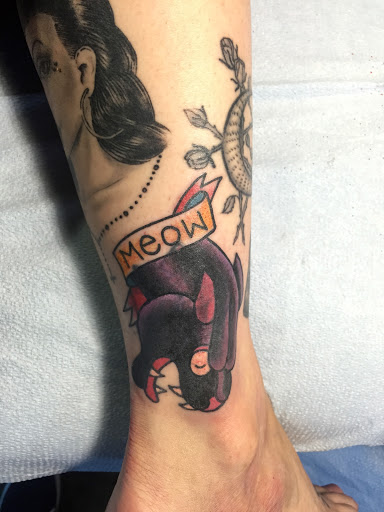 Explore red cardinal tattoo ideas, creative tattoo ideas in Reno, available at Aces Tattoo