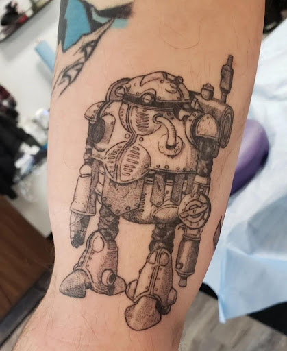 Explore charm tattoo ideas, creative tattoo ideas in Coeur D Alene, available at Little Bear Tattoo Co.