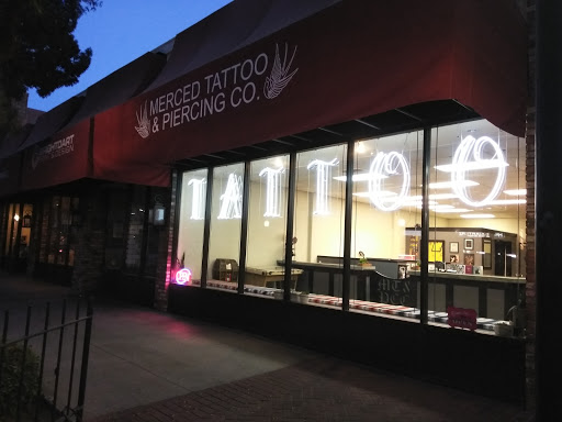 Explore coy fish tattoo ideas, creative tattoo ideas in Merced, available at Merced Tattoo and Piercing Co.