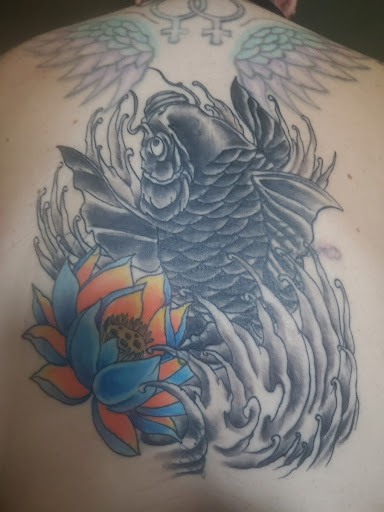 Explore cover up tattoo ideas female back, creative tattoo ideas in Phoenix, available at The Snooty Fox Tattoo and piercing