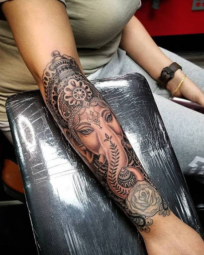 Explore tattoo ideas for book lovers, creative tattoo ideas in Anchorage, available at SDITATTOO, LLC