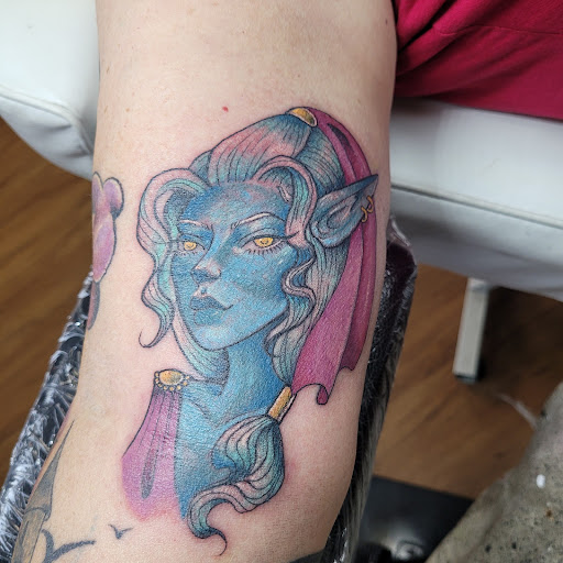 Explore lion and lamb tattoo ideas, creative tattoo ideas in Anniston, available at Lucid Dreams Tattoos and Piercings