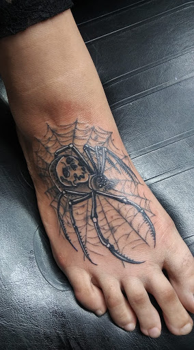 Explore widow tattoo ideas, creative tattoo ideas in Crystal City, available at Meraki Tattoo and Piercing