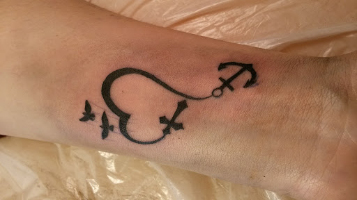 Find tattoo ideas bear for your next unique tattoo in Sigourney at Octopus Ink Professional Tattoo & Piercing