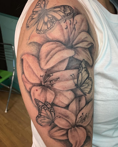 Explore flower tattoo ideas on arm, creative tattoo ideas in Hayward, available at Three Tentacles Tattoo Studio