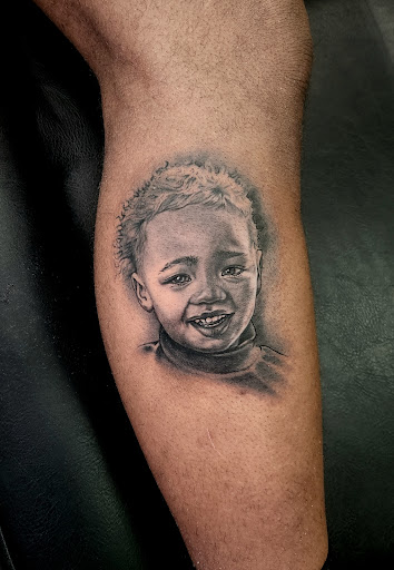 Explore red hand tattoo ideas, creative tattoo ideas in Independence, available at Bare Skin Tattoo