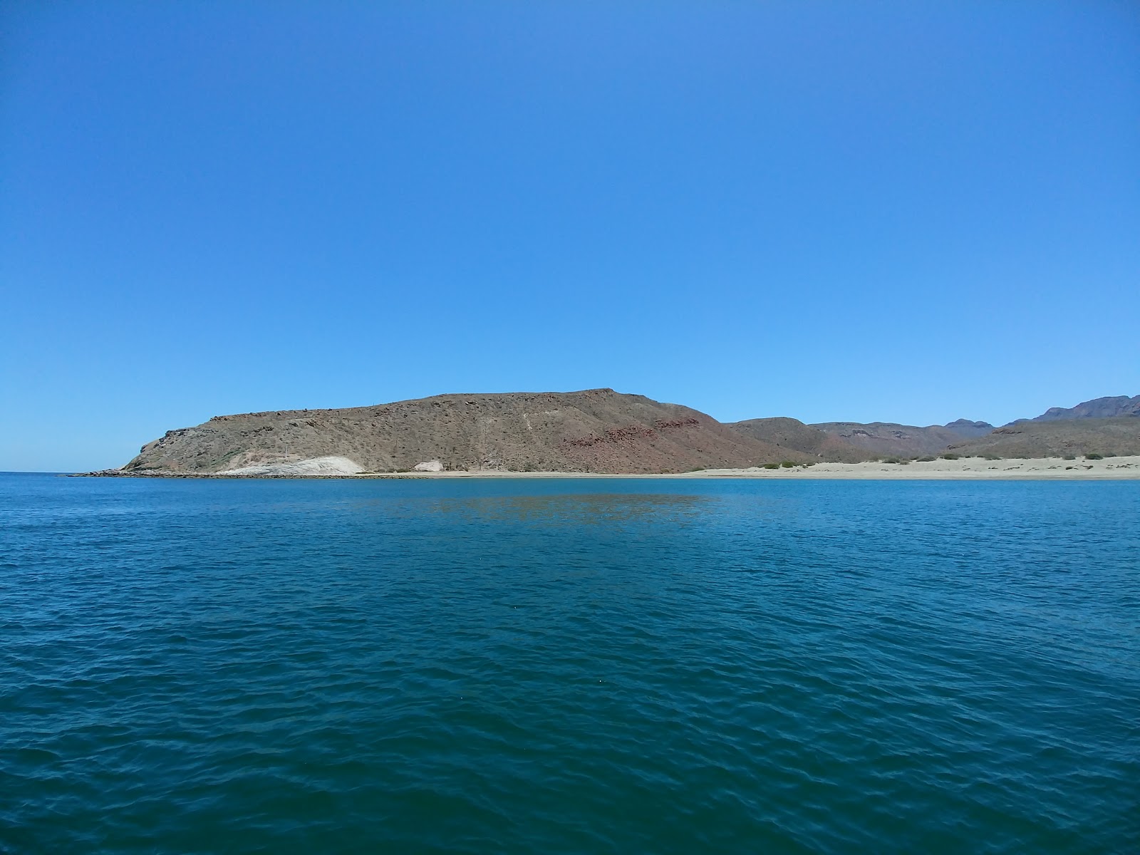 Valokuva Playa Punta Mechudoista. pinnalla sininen vesi:n kanssa