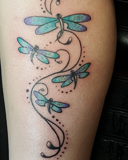 Explore women's leg sleeve tattoo ideas, creative tattoo ideas in Williamston, available at Lucky Tiger Tattoo studio