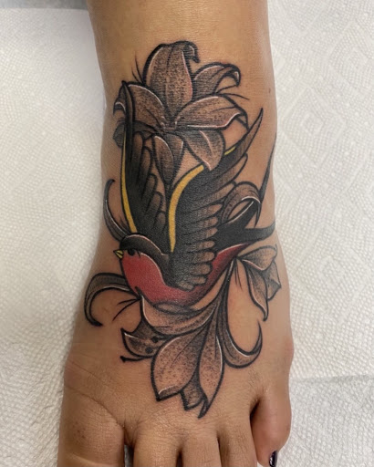 Explore neck tattoo ideas for women, creative tattoo ideas in Davenport, available at Fine Ink Studios Tattoos