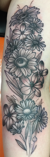 Explore watercolor tattoo ideas for females, creative tattoo ideas in Batavia, available at A Thin Line Tattoo