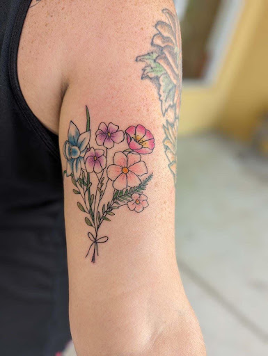 Explore bluebird tattoo ideas, creative tattoo ideas in Cornelia, available at Prismatic Pulse Tattoo