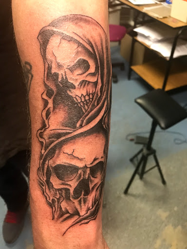 Explore red tattoo cover up ideas, creative tattoo ideas in Muncie, available at The Tattoo Studio