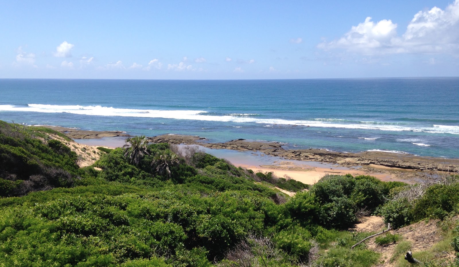 Photo de Praia Massano avec l'eau turquoise de surface